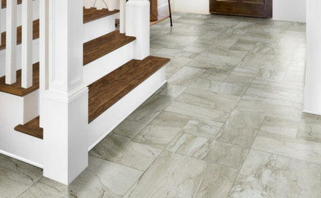 Waterproof Tile in Entry Way with Hardwood Stairs